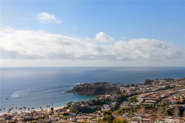 a front view of a house with a yard and balcony