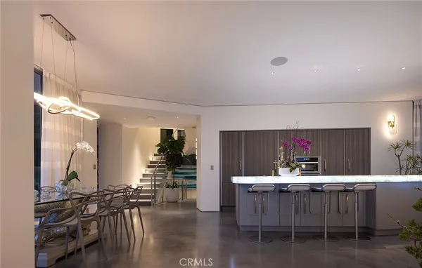 a kitchen with a table and chairs