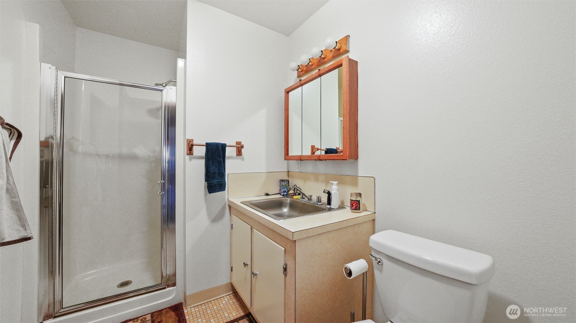 338 East Bramhall Road Dayton, WA 99328 - Photo 11 of 40 a bathroom with a sink a toilet and shower