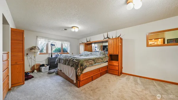 a bedroom with a bed and a cabinets