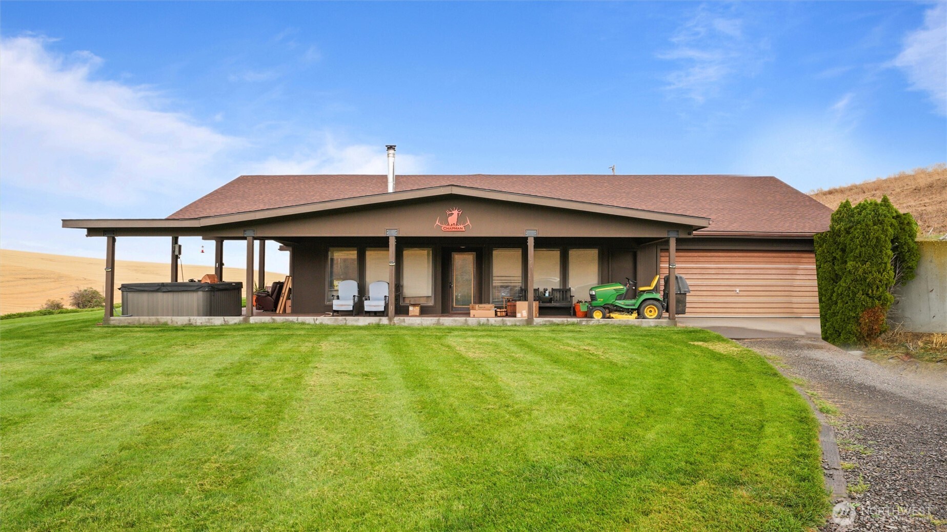 338 East Bramhall Road Dayton, WA 99328 - Photo 4 of 40 a front view of a house with swimming pool having outdoor seating