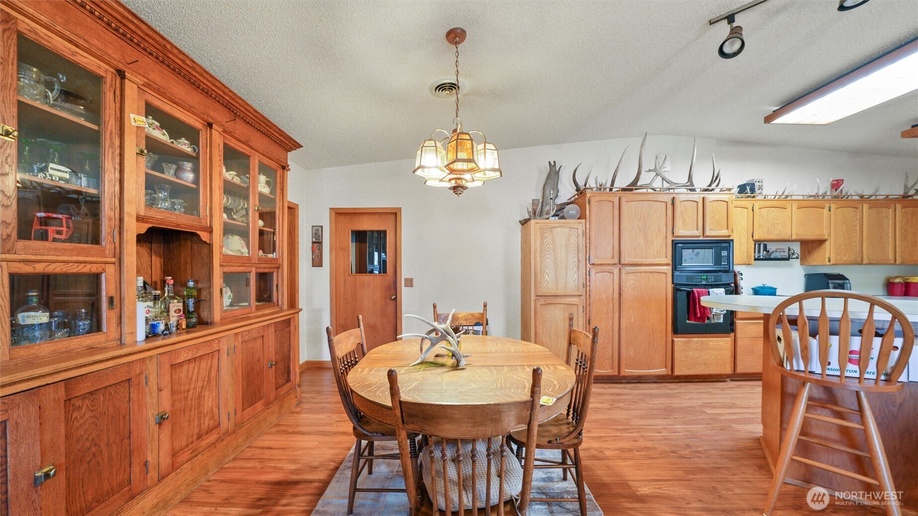 338 East Bramhall Road Dayton, WA 99328 - Photo 10 of 40 a dining room with furniture a chandelier and wooden floor
