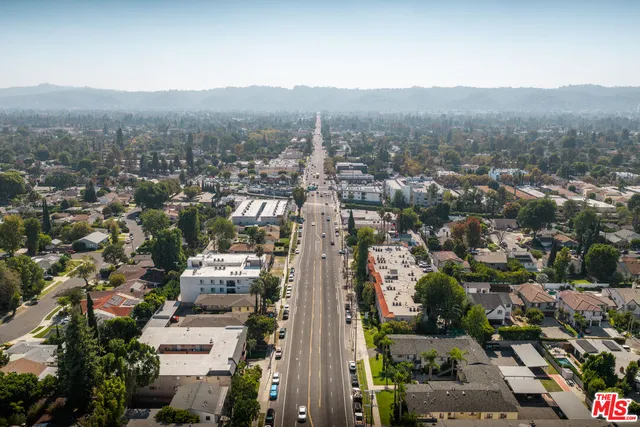a swimming pool with outdoor seating and yard