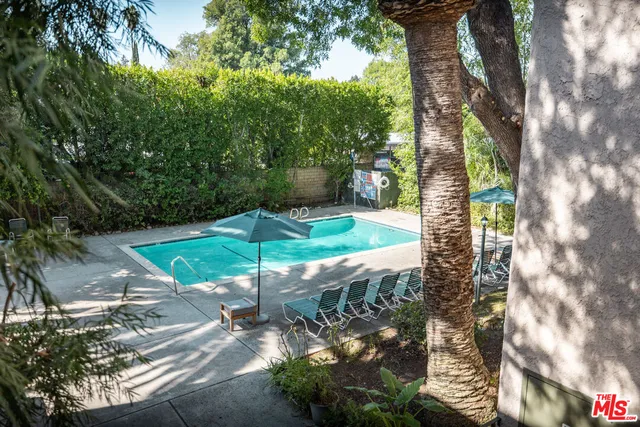 a view of a garden with an outdoor seating