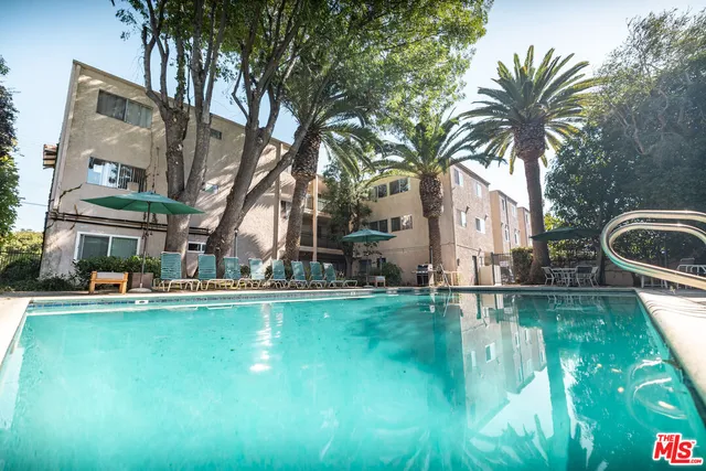 a view of a street with a building in the background
