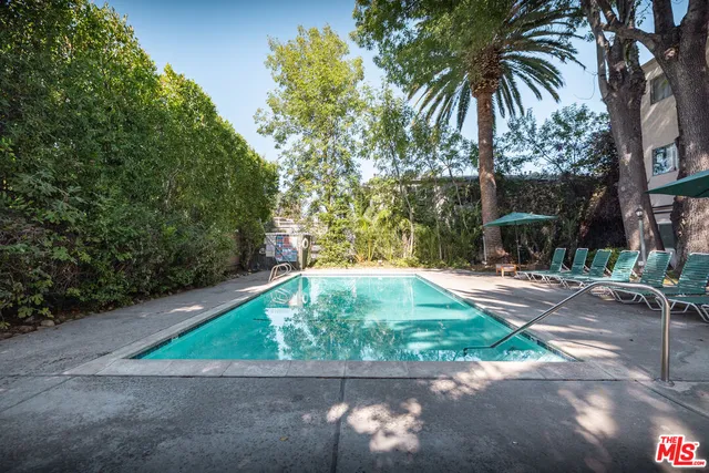 a bathroom with a mirror and a shower