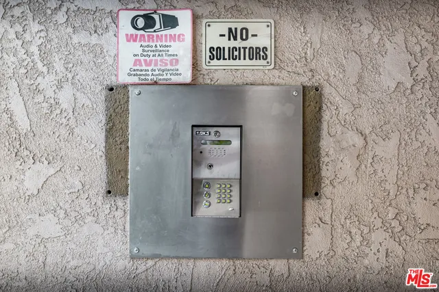 a view of an empty room with wooden and a window
