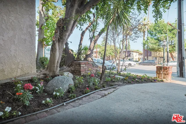 a kitchen with a sink cabinets and window