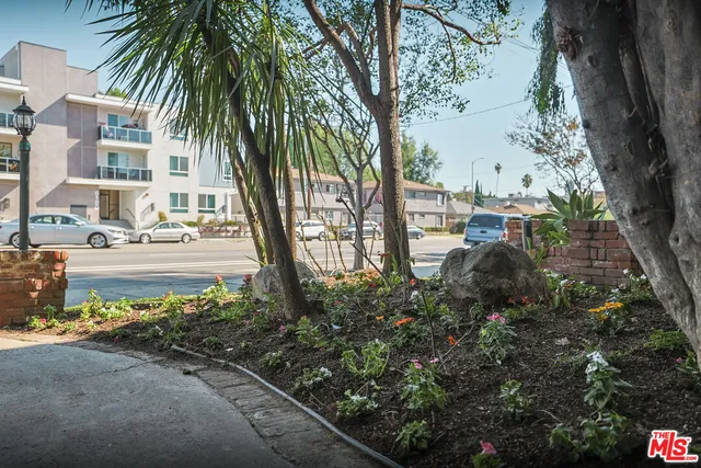 a kitchen with a stove top oven and cabinets