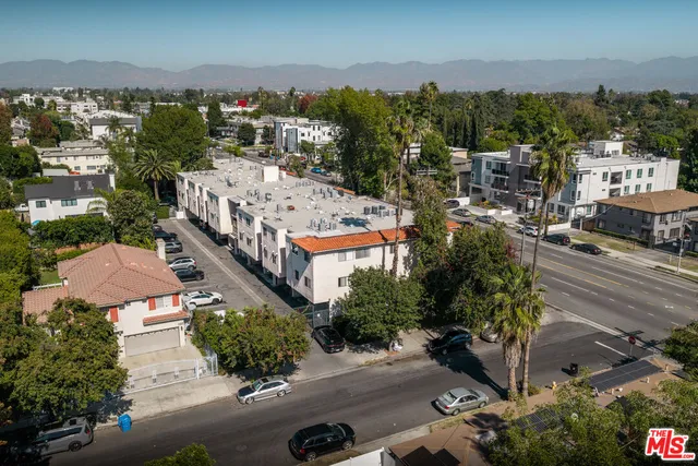 a view of a city street with a building