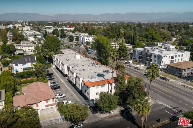 an aerial view of a house with outdoor space