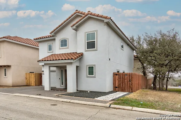 a front view of a house with a garage
