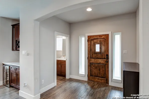 an empty room with wooden floor and closet