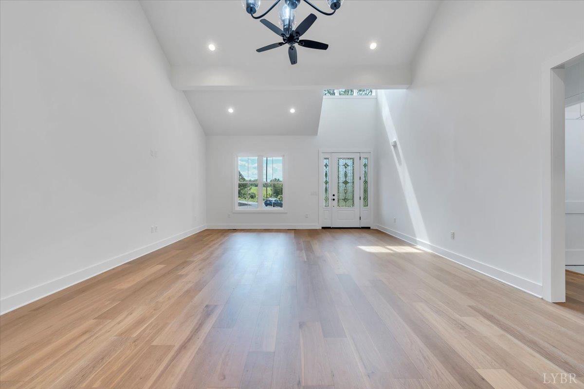 1218 Morgans Church Road Bedford, VA 24523 - Photo 11 of 53 an empty room with wooden floor and windows