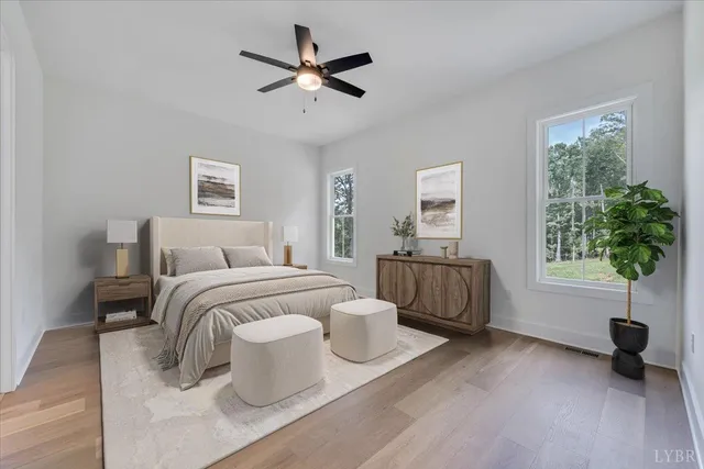 a bedroom with a large bed and a window