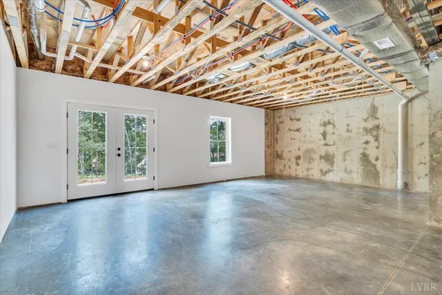 a view of an empty room with windows