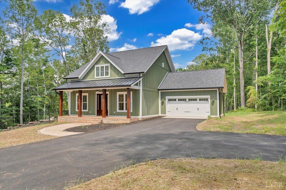 1218 Morgans Church Road Bedford, VA 24523 - Photo 49 of 53 a front view of a house with a garden