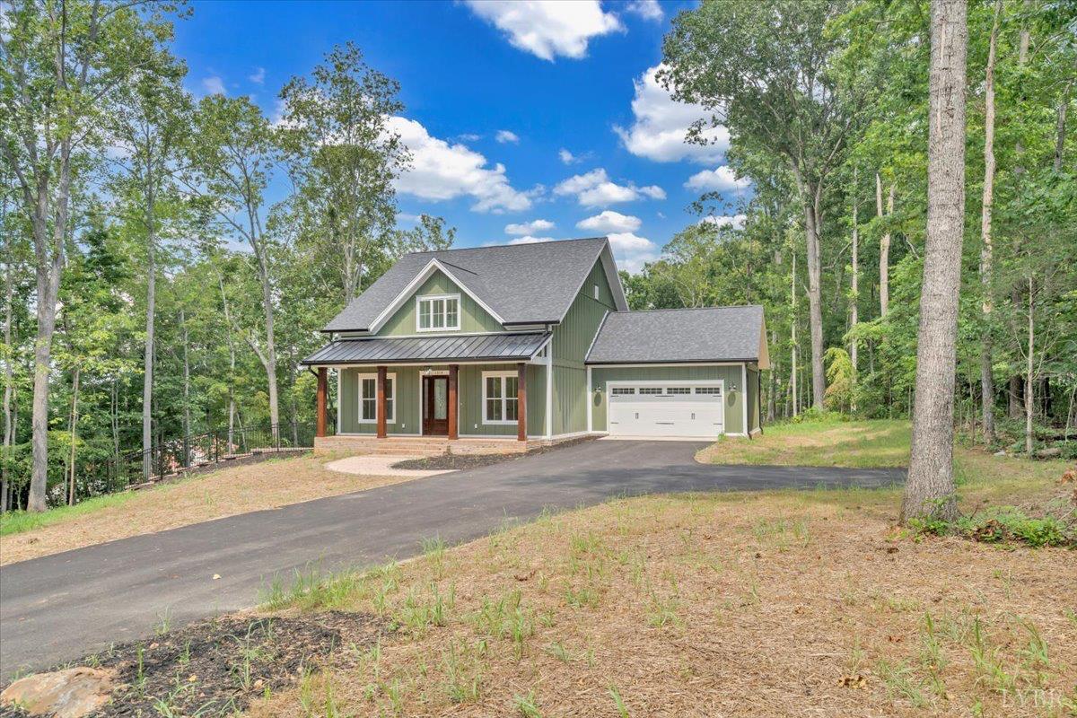 1218 Morgans Church Road Bedford, VA 24523 - Photo 50 of 53 a front view of a house with a yard and garage