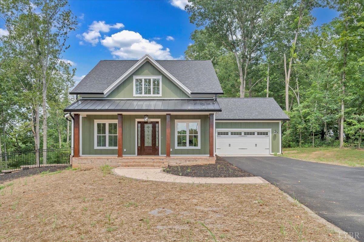 1218 Morgans Church Road Bedford, VA 24523 - Photo 52 of 53 a front view of a house with a yard and trees