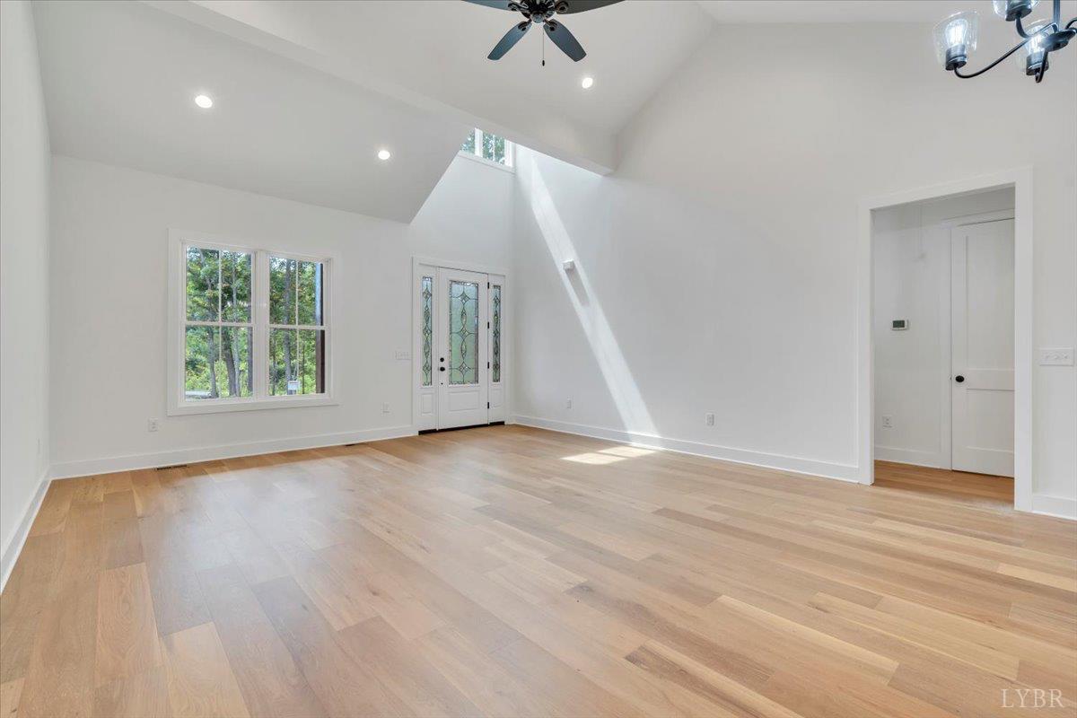 1218 Morgans Church Road Bedford, VA 24523 - Photo 10 of 53 an empty room with wooden floor and windows