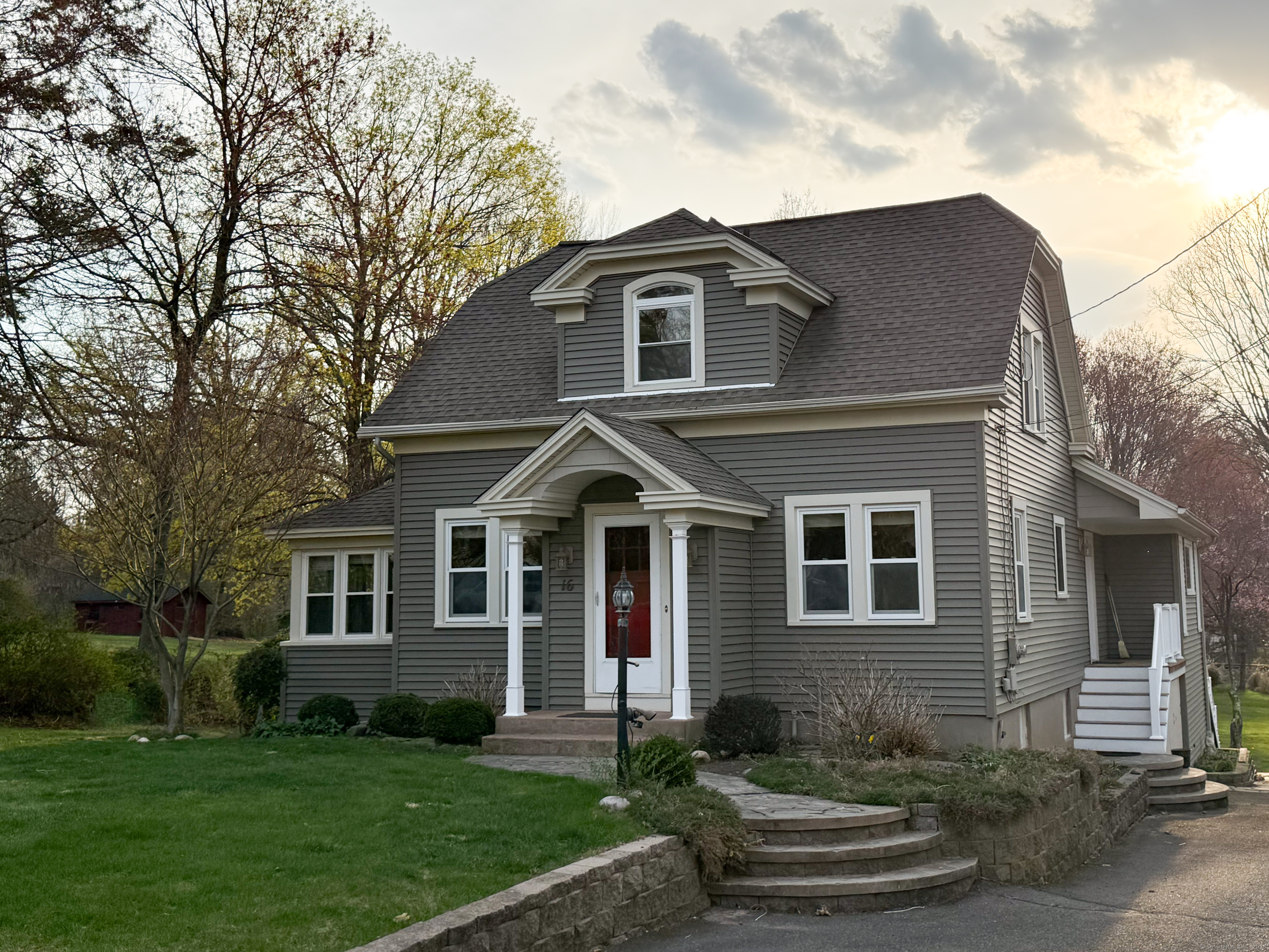 a front view of a house with a yard