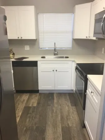 a view of a hallway with windows