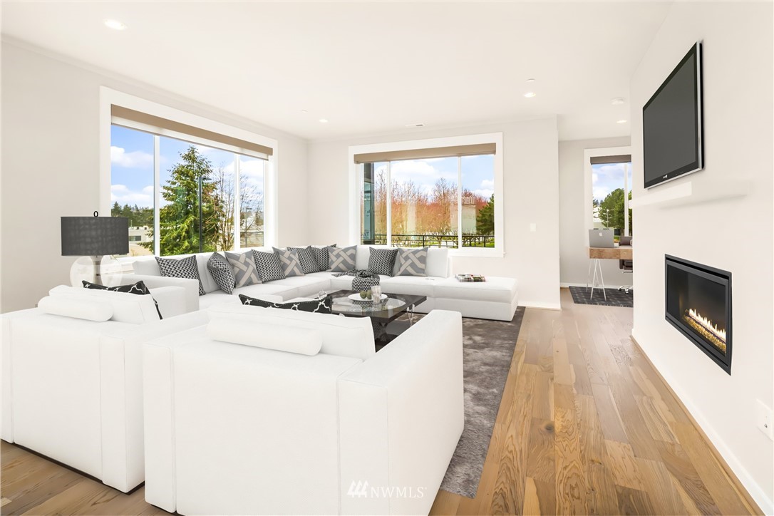 21711 25th Avenue Southeast, Unit A Bothell, WA 98021 - Photo 5 of 12 a living room with furniture and a fireplace