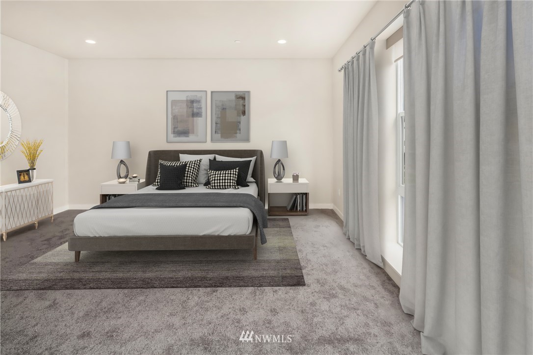 21711 25th Avenue Southeast, Unit A Bothell, WA 98021 - Photo 6 of 12 a spacious bedroom with a bed and a window