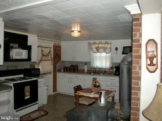 4775 Dividing Road Salisbury, MD 21801 - Photo 4 of 9 a kitchen with cabinets and a stove