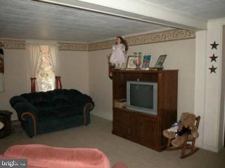 4775 Dividing Road Salisbury, MD 21801 - Photo 5 of 9 a bedroom with a bed and a tv in it