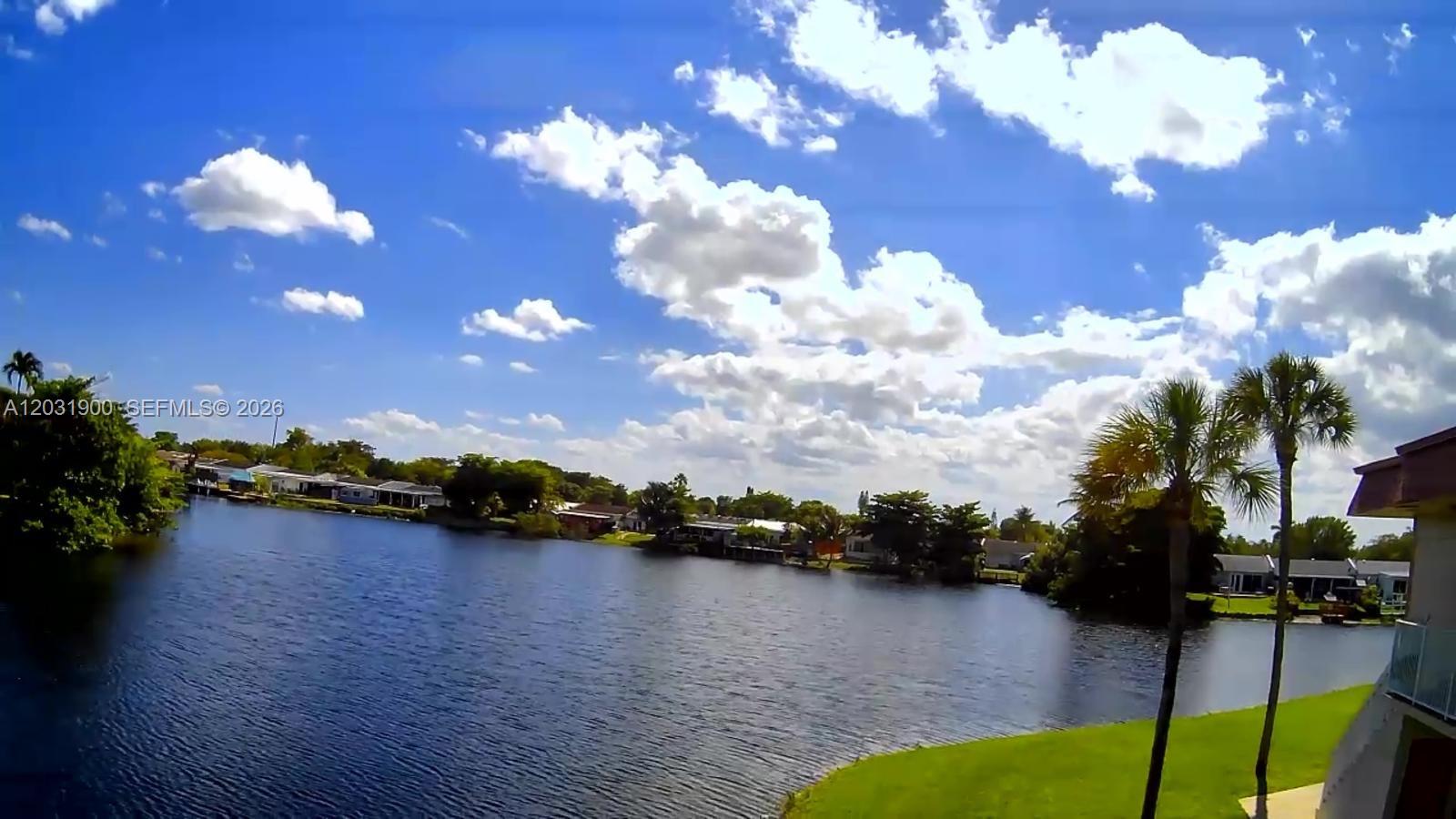 12860 Southwest 43rd Drive, Unit 146B Miami, FL 33175 - Photo 5 of 12 a view of a lake in middle of the house