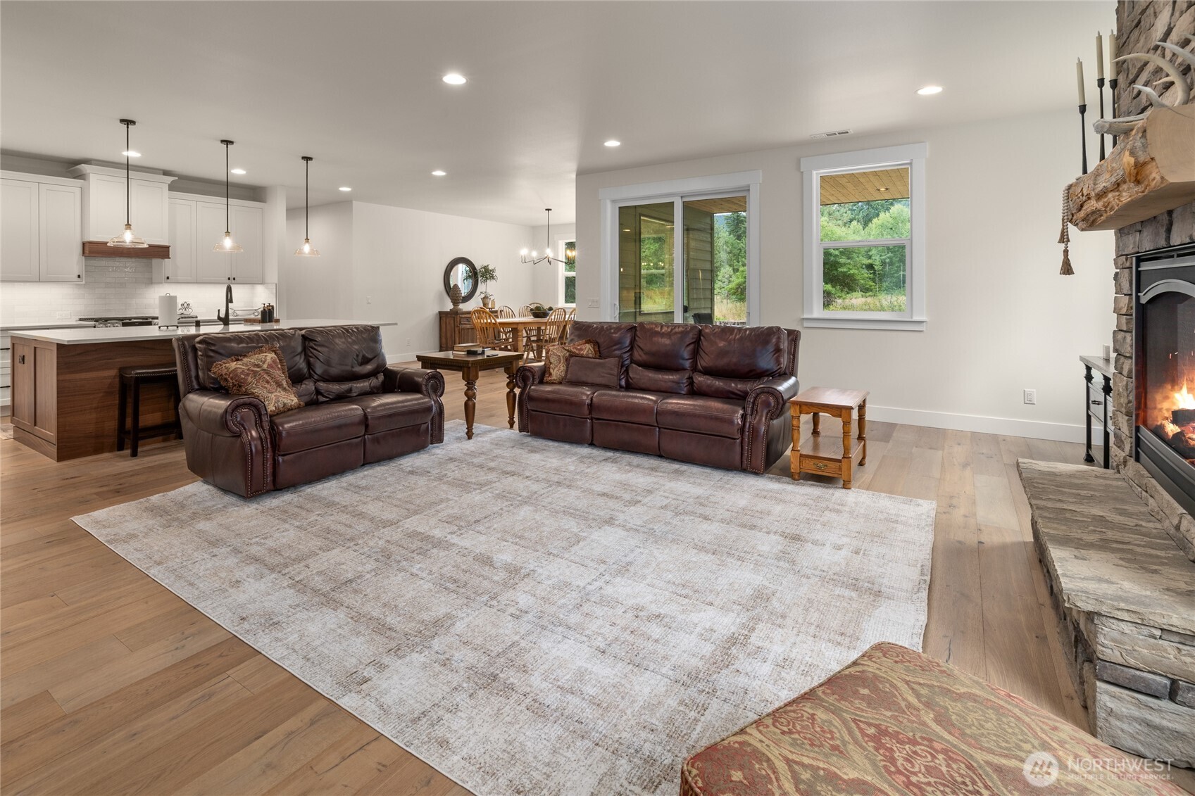 1111 Old Cedars Road Cle Elum, WA 98922 - Photo 12 of 31 a living room with furniture and a flat screen tv