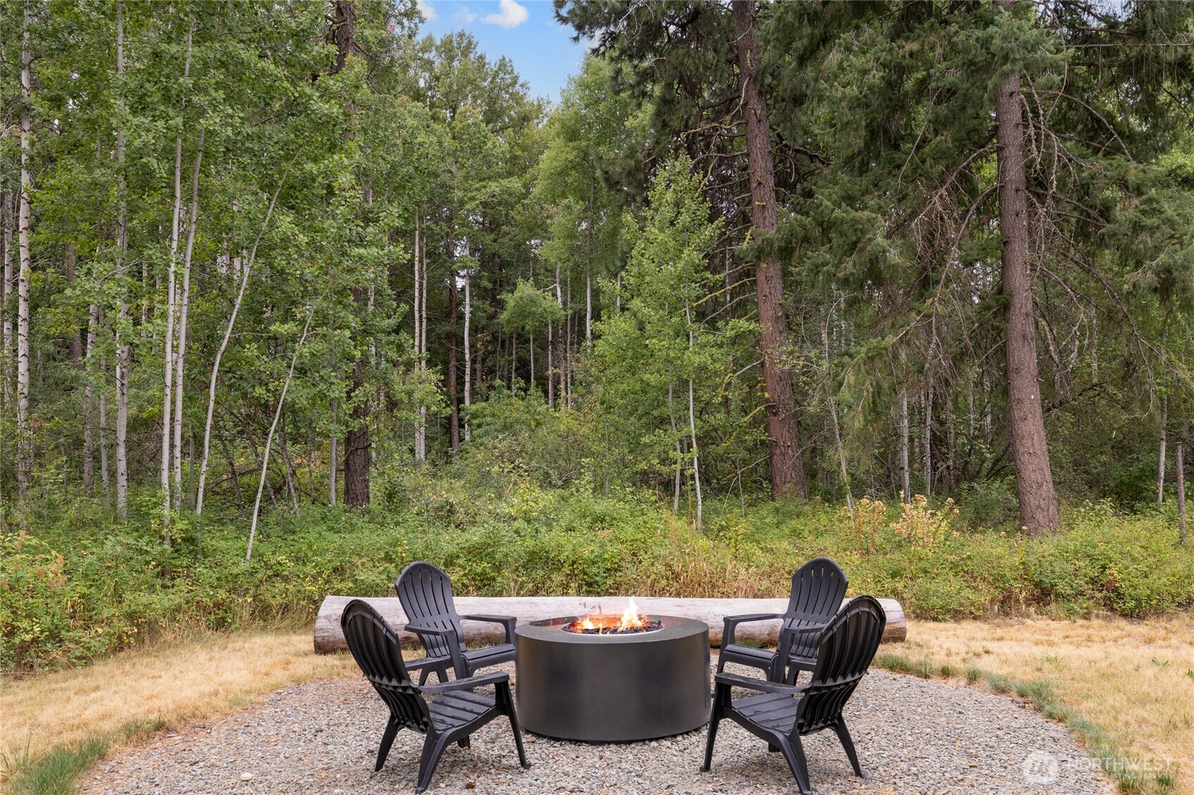 1111 Old Cedars Road Cle Elum, WA 98922 - Photo 20 of 31 a view of a chairs and table in the backyard
