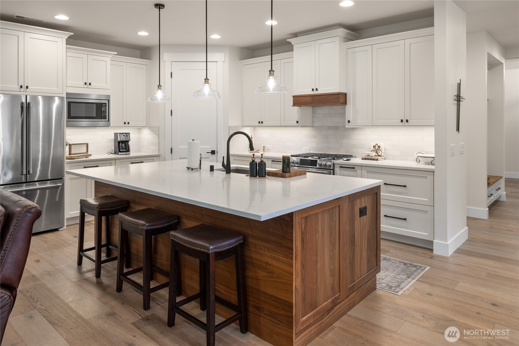 1111 Old Cedars Road Cle Elum, WA 98922 - Photo 6 of 31 a kitchen with kitchen island granite countertop a sink a stove a refrigerator and chairs