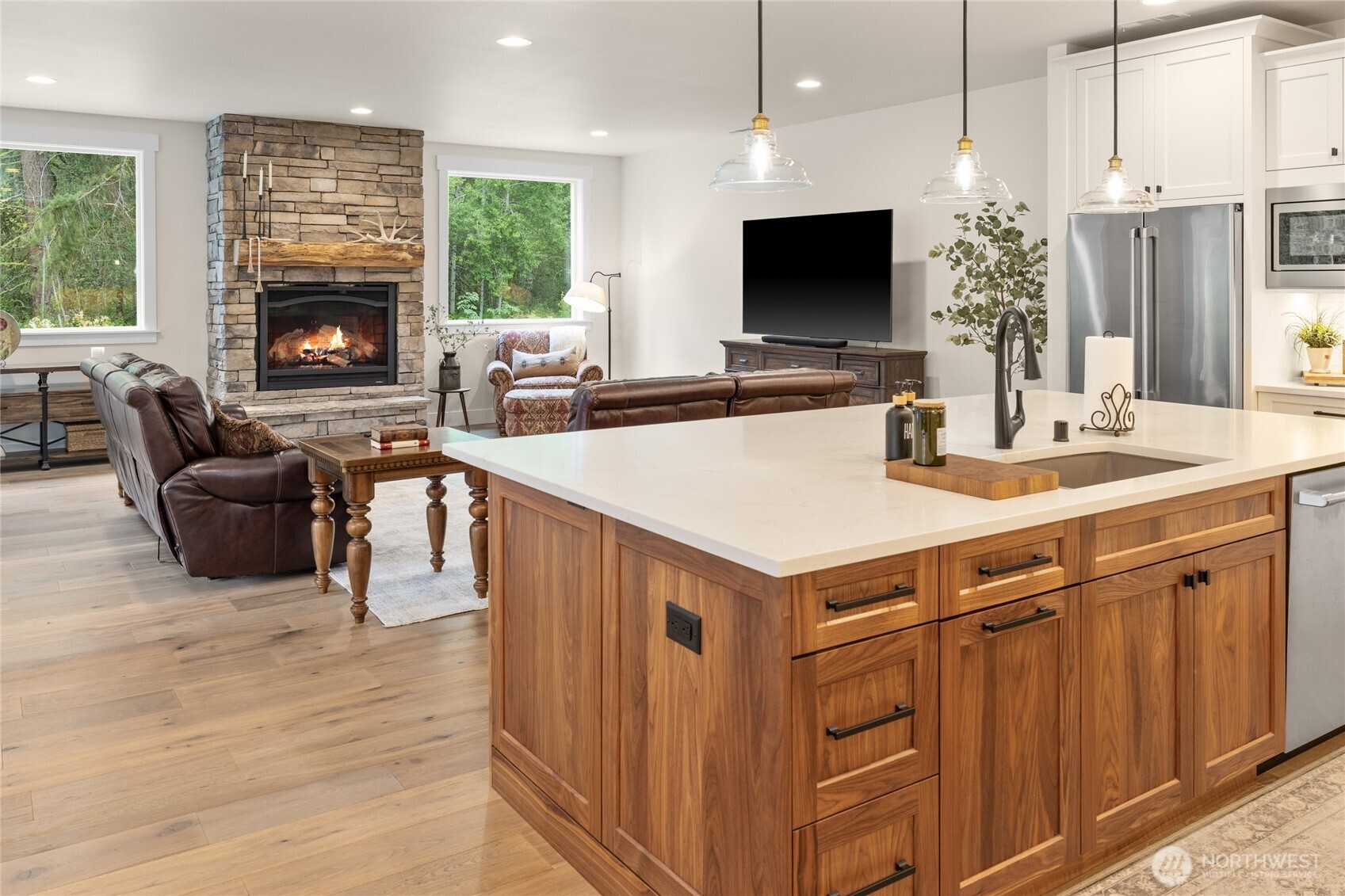 1111 Old Cedars Road Cle Elum, WA 98922 - Photo 8 of 31 a living room with furniture a fireplace and a flat screen tv