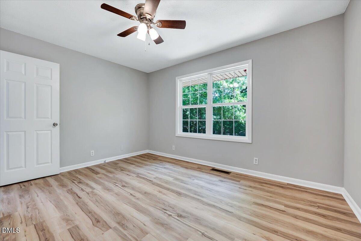 3408 Atlantic Avenue Raleigh, NC 27604 - Photo 9 of 48 a view of empty room with wooden floor and fan
