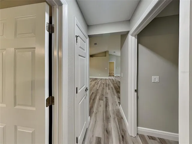 a view of a bathroom from a hallway