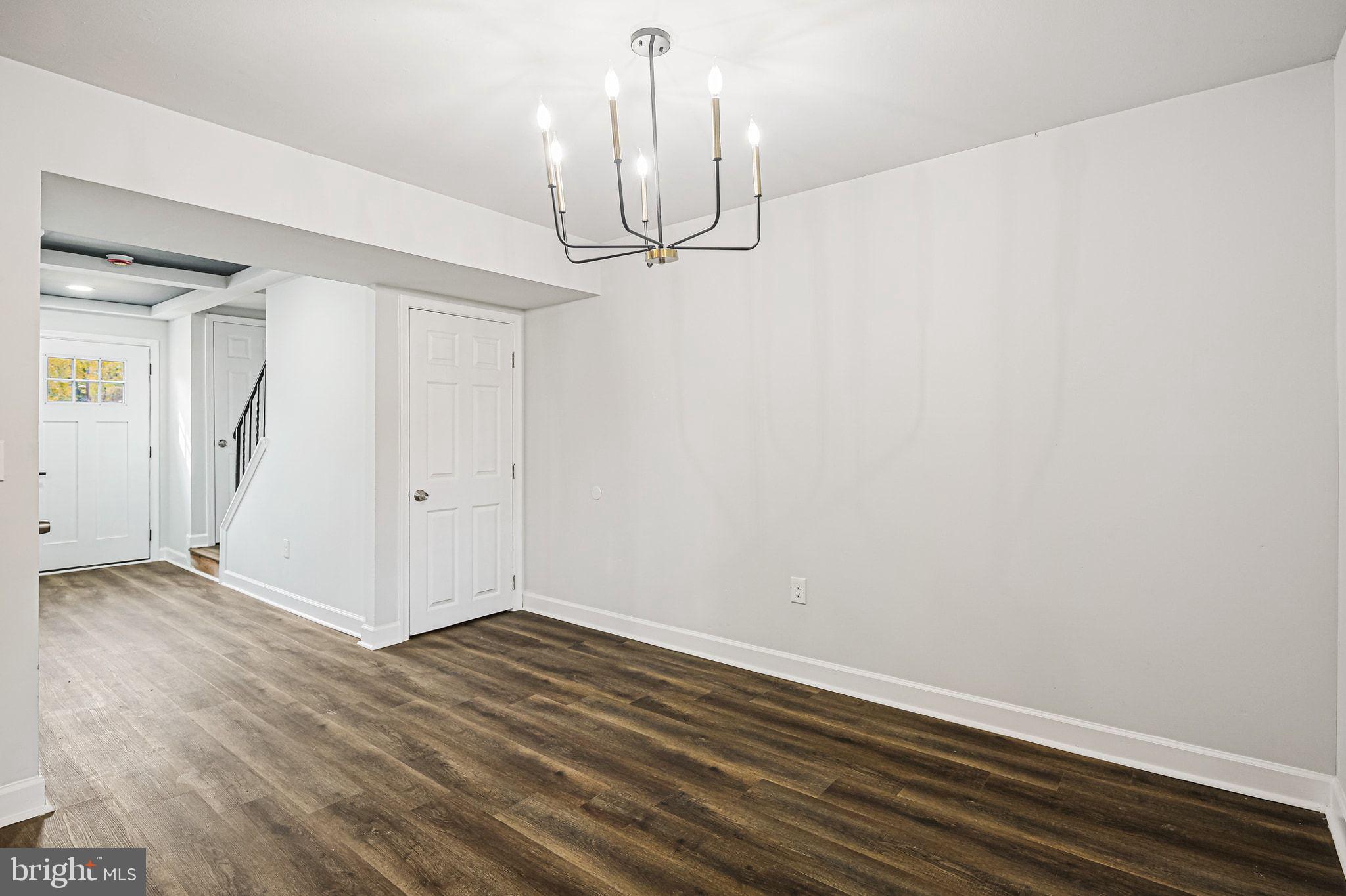 4702 Vancouver Road Baltimore, MD 21229 - Photo 12 of 33 a view of empty room with wooden floor