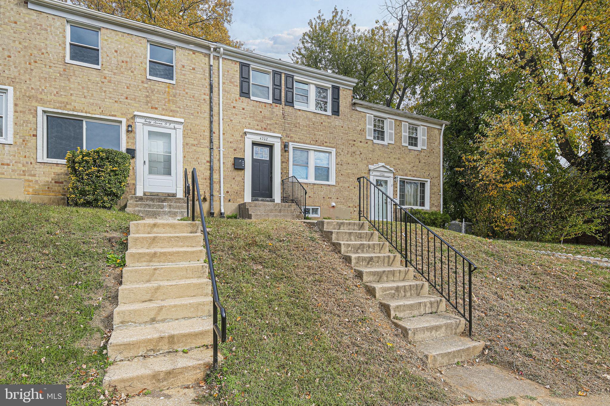4702 Vancouver Road Baltimore, MD 21229 - Photo 2 of 33 a front view of a house with a yard