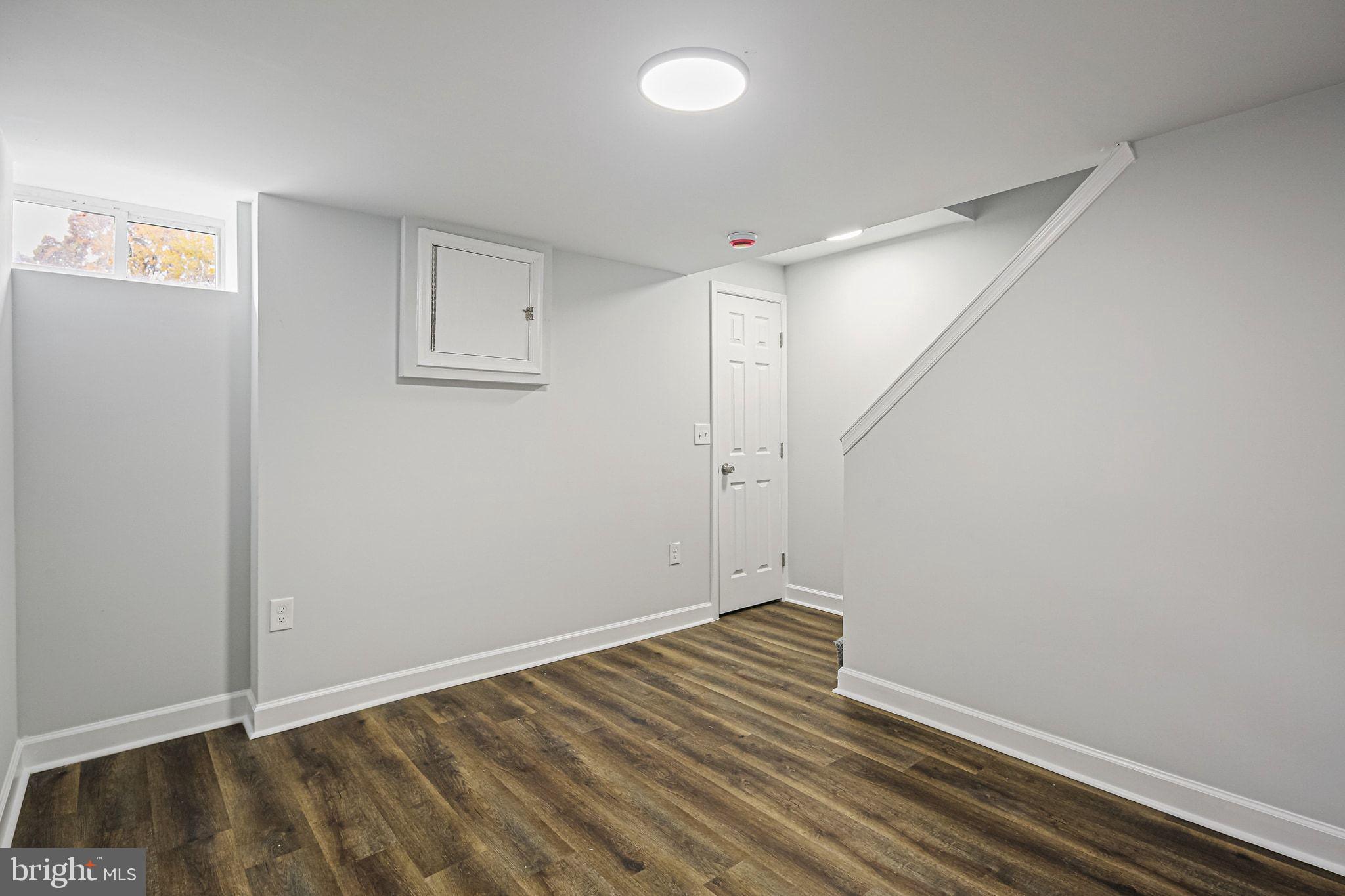 4702 Vancouver Road Baltimore, MD 21229 - Photo 25 of 33 a view of room with wooden floor