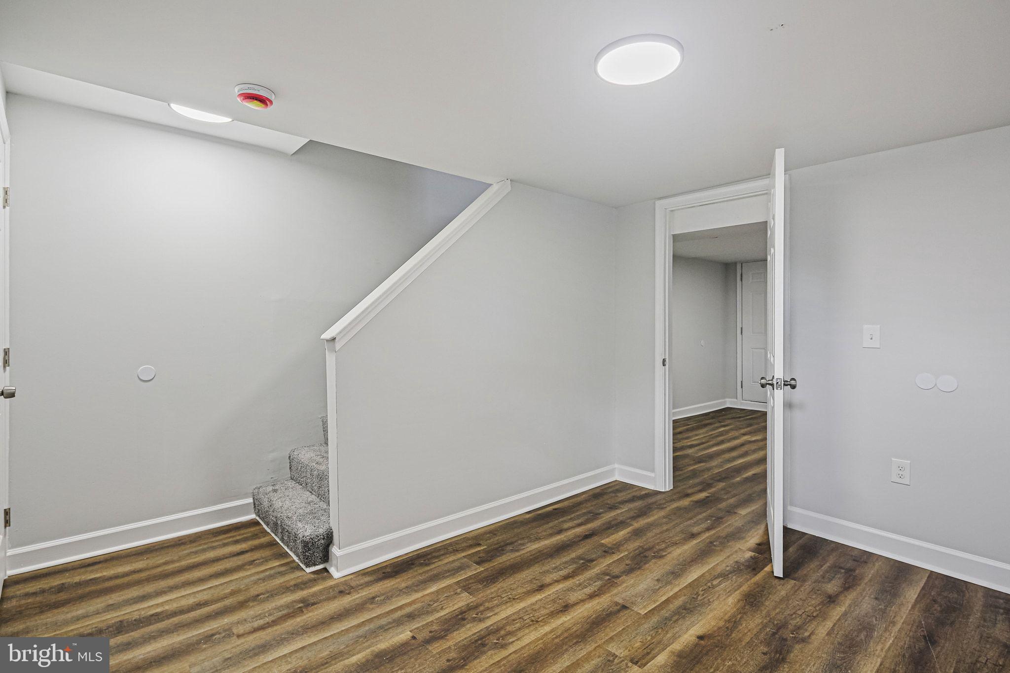4702 Vancouver Road Baltimore, MD 21229 - Photo 26 of 33 wooden floor in an empty room