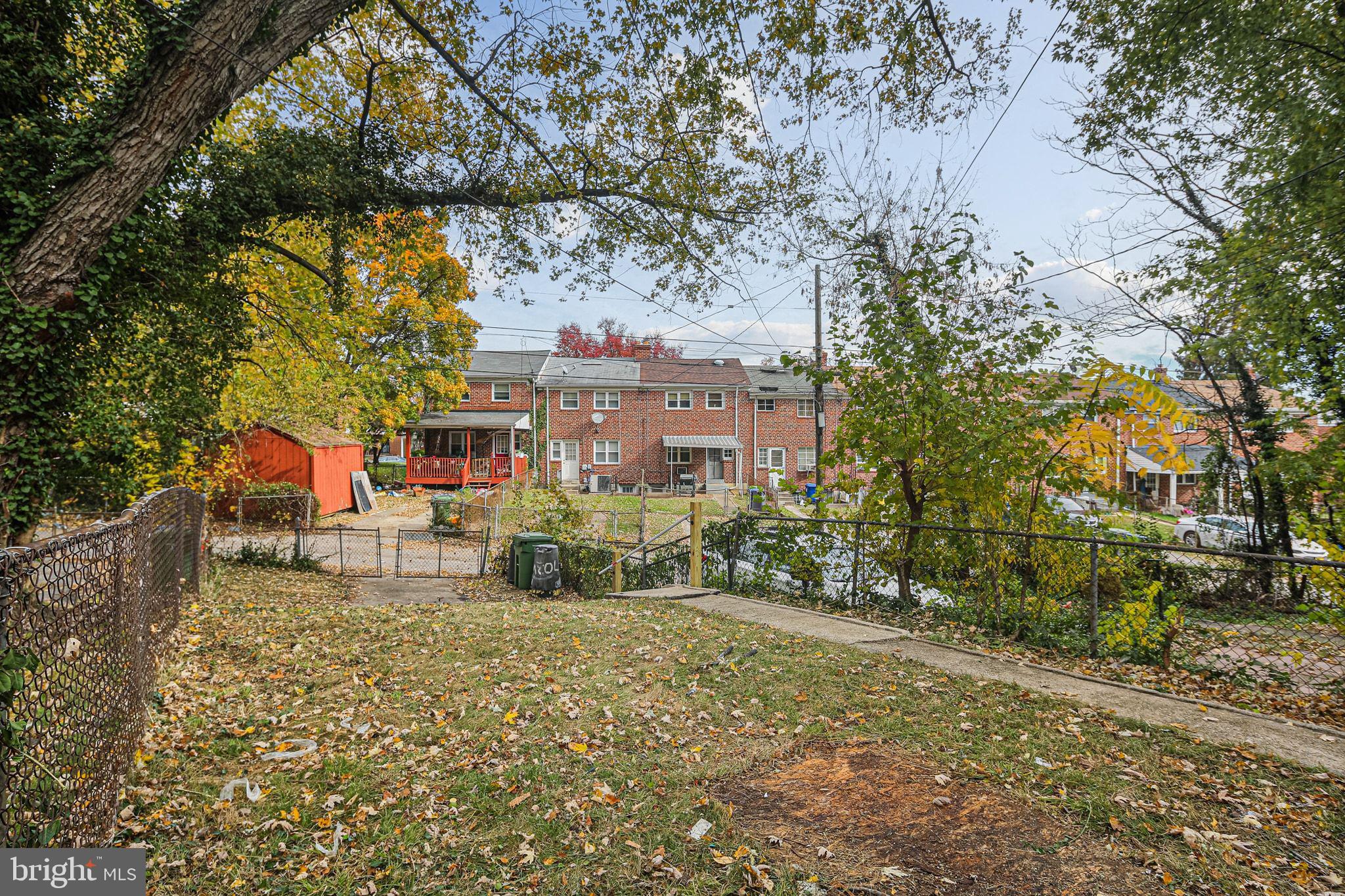 4702 Vancouver Road Baltimore, MD 21229 - Photo 30 of 33 a wooden bench sitting in front of a building