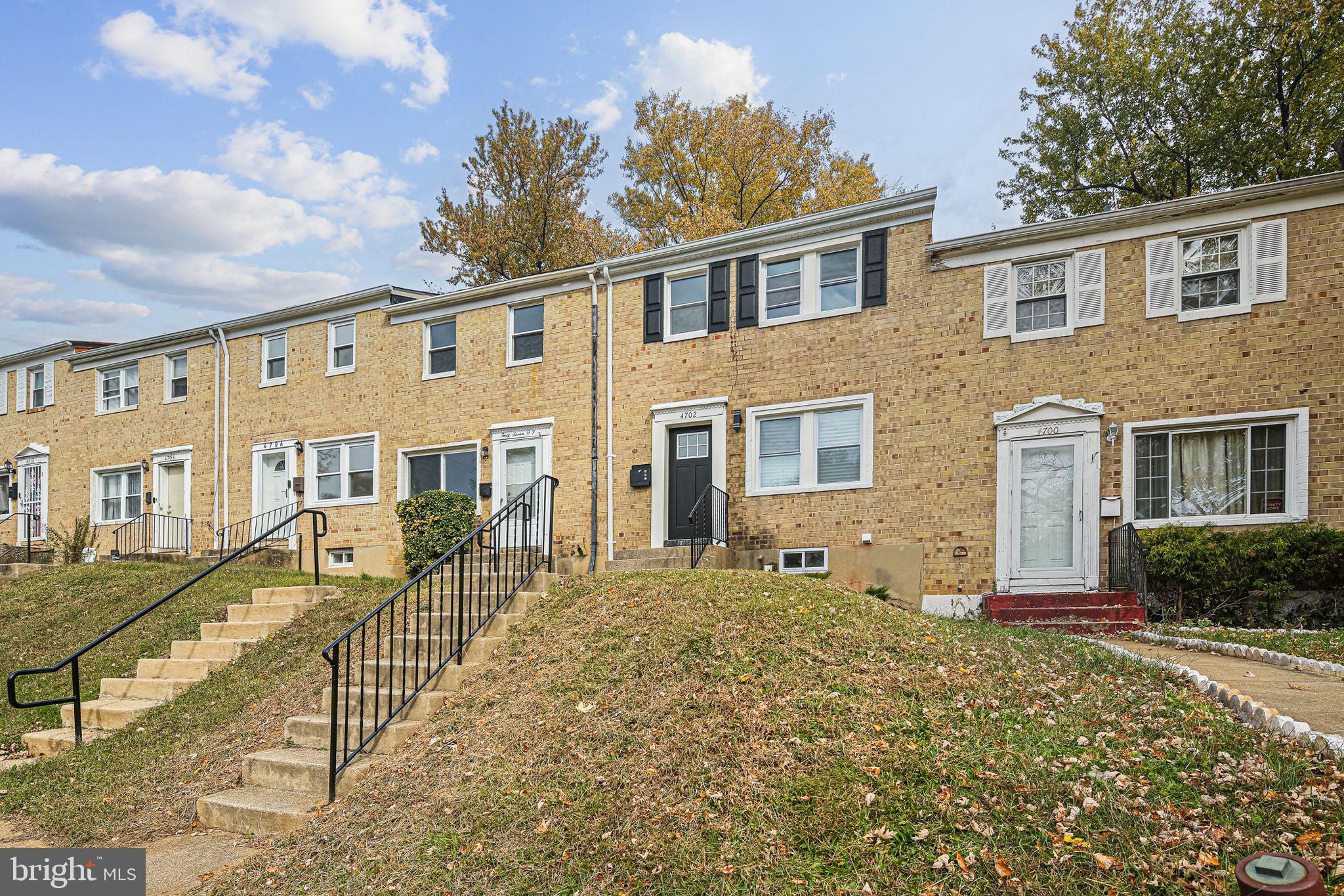 4702 Vancouver Road Baltimore, MD 21229 - Photo 3 of 33 a front view of a house with a yard