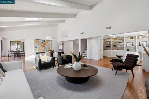 a living room with furniture and a rug