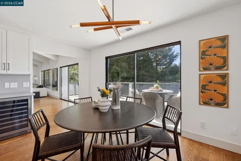 a view of a dining room with furniture window and outside view