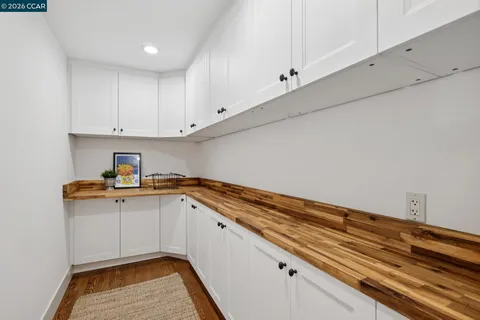 a kitchen with granite countertop a sink and cabinets