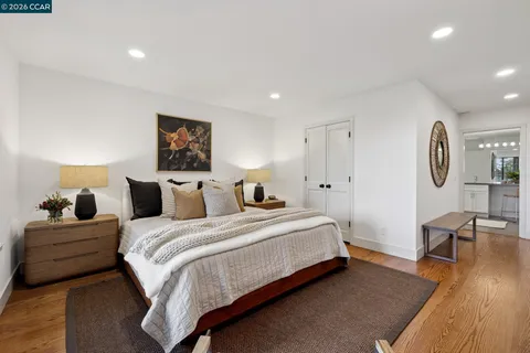 a bedroom with bed and window