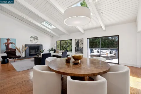 a dining room with furniture garden view and a fireplace