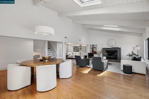 a view of living room with furniture and fireplace