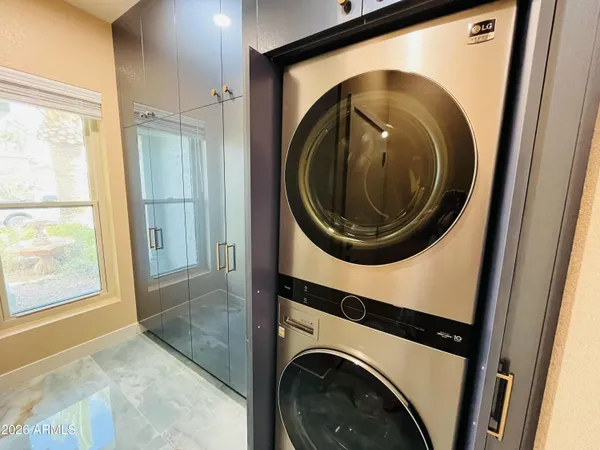 a view of a hallway with washer and dryer
